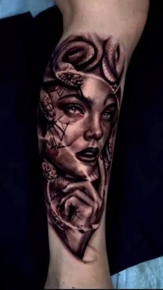 Medusa portrait black and grey forearm tattoo