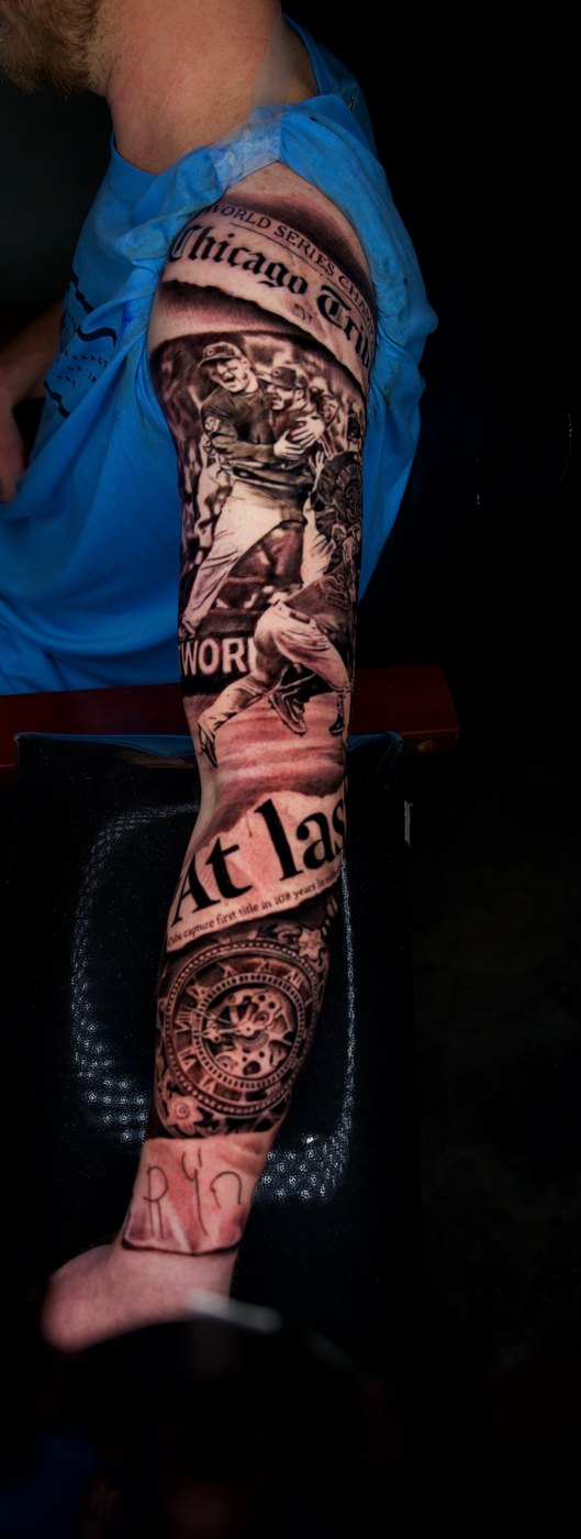 Chicago Cubs World Series newspaper black and grey full sleeve tattoo by Bubba Irwin
